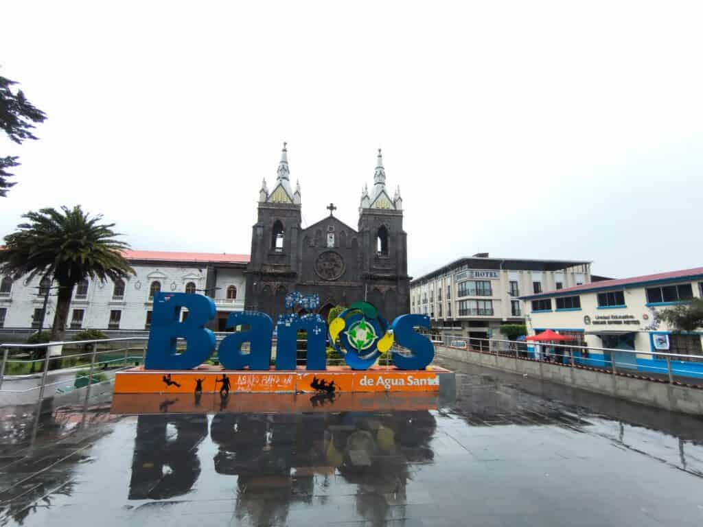 Baños de Agua Santa sign and church