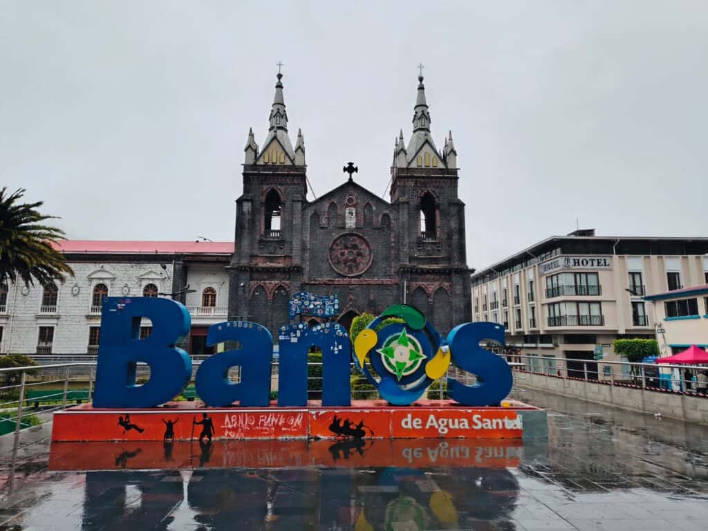 Baños de Agua Santa sign before church