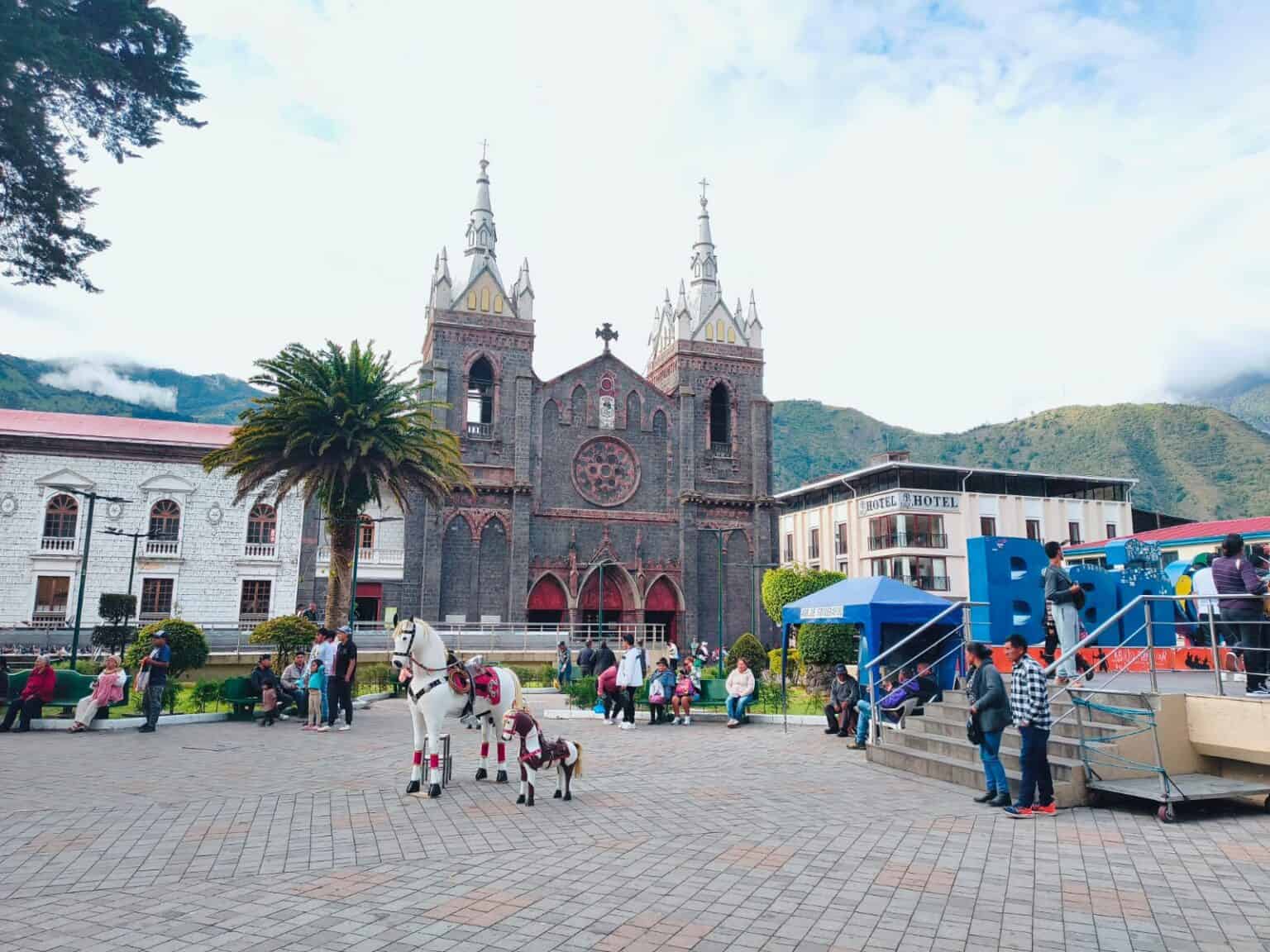 Town square with church, mountains, and white horse