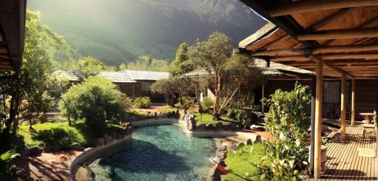 Eco-lodge with pool surrounded by green mountains