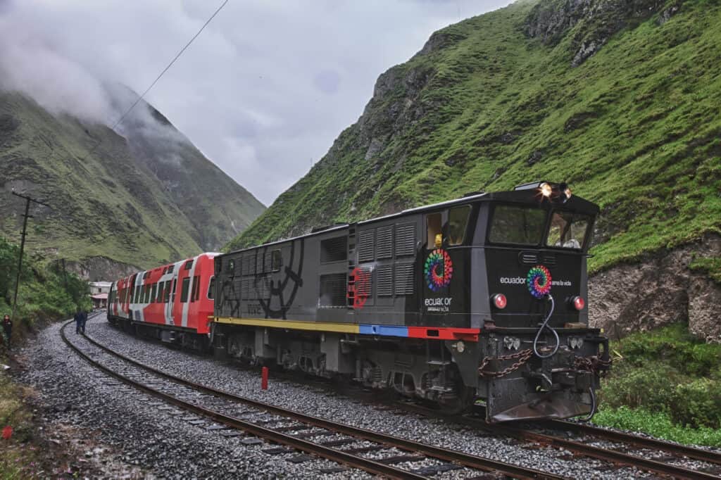 Train crossing green mountains in Ecuador
