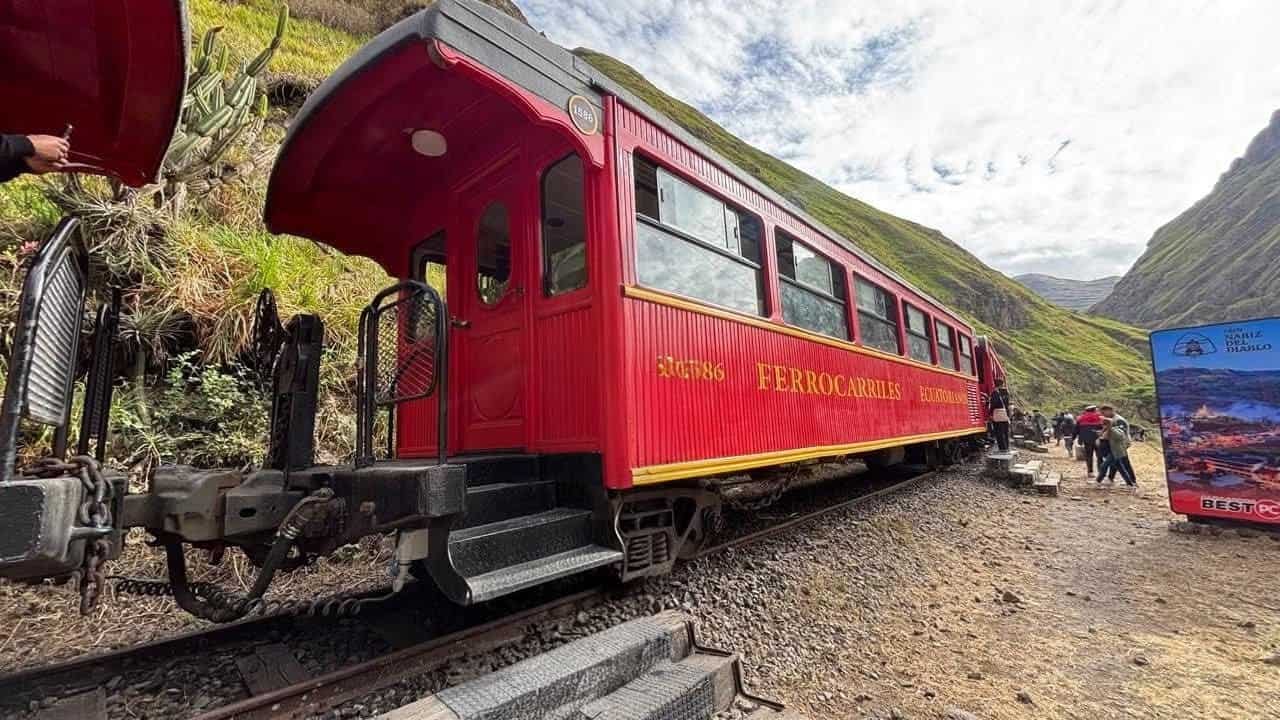 Red Ecuador train in mountain valley